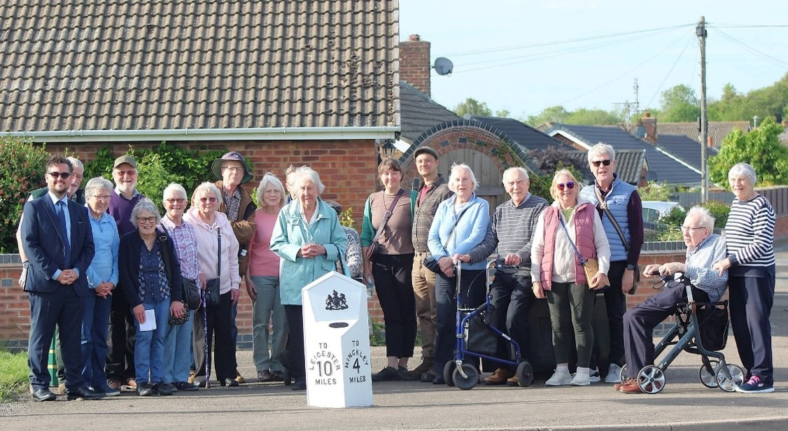Cllr Ben Taylor and Local Residents with the Restored Sapcote Milestone
